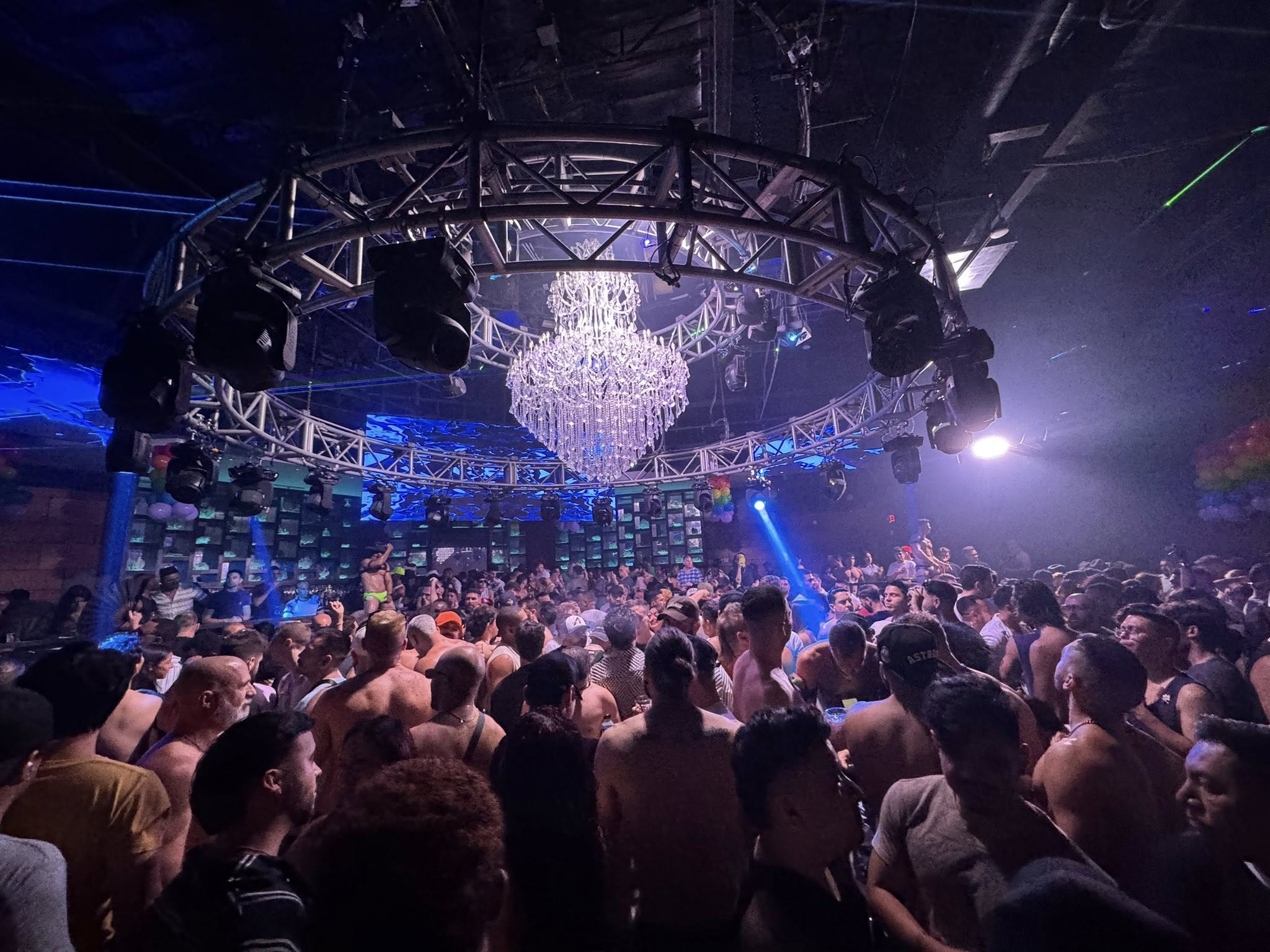 Crowded dance floor at South Beach Houston with colorful lights